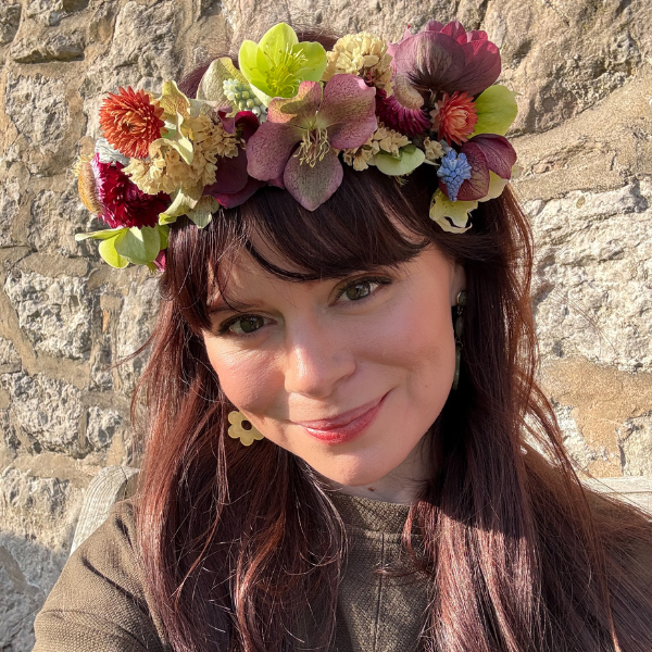 May & June founder wearing a bridal flower crown made using locally grown British flowers, perfect for eco-friendly / sustainable weddings.