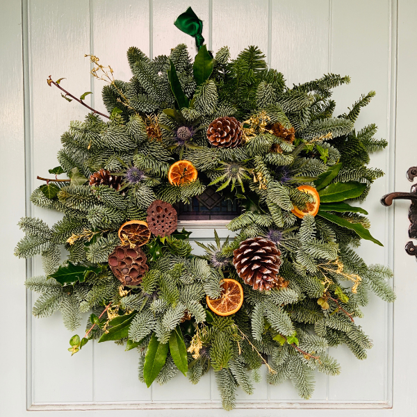 Abundant Christmas wreath made using season British foliage and dried ingredients
